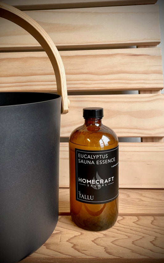 Eucalyptus essence beside a black sauna bucket