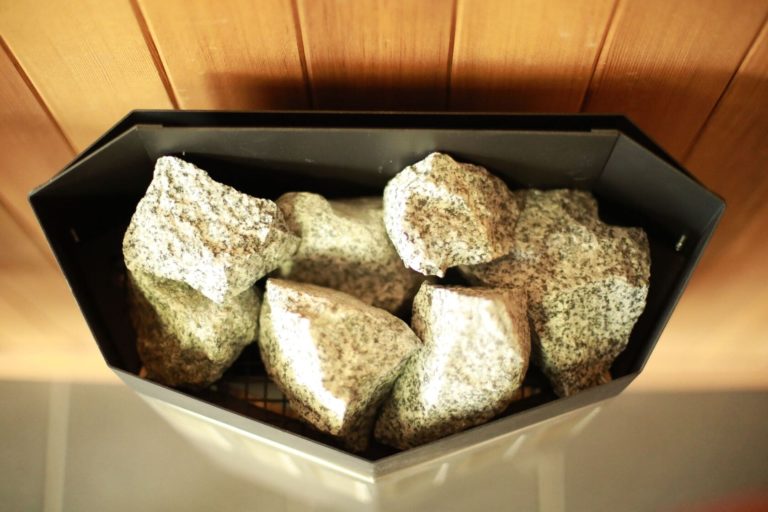Sauna stones packed into a heater tray