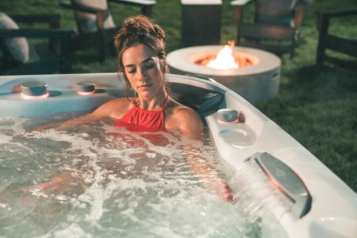 Woman enjoying the hot tub benefits in her Sundance spa