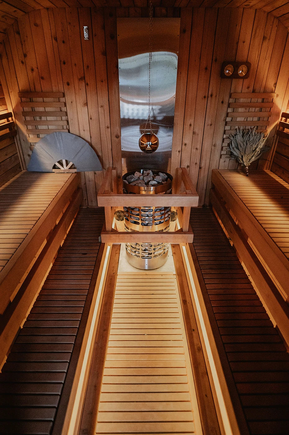 Cedar sauna interior with heater and heat shield