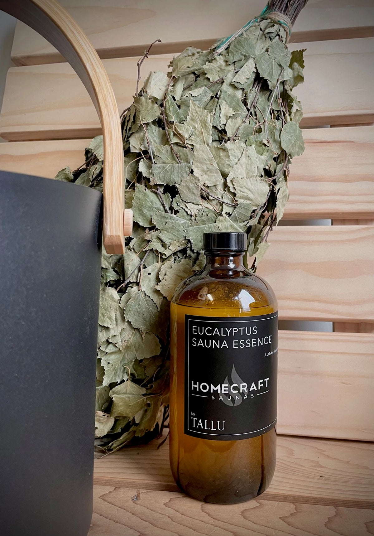 Eucalyptus sauna essence bottle on a cedar bench