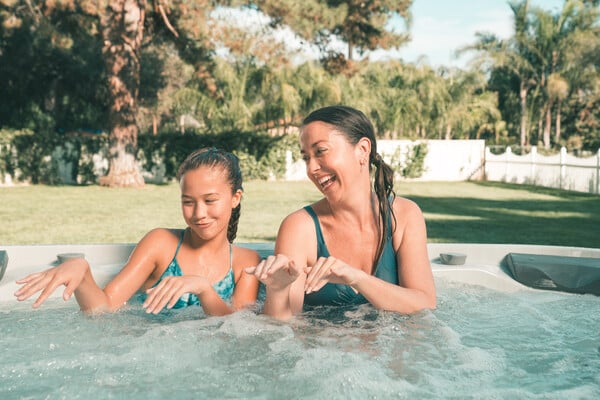 Mother and Daughter enjoying the hot tub benefits; quality time