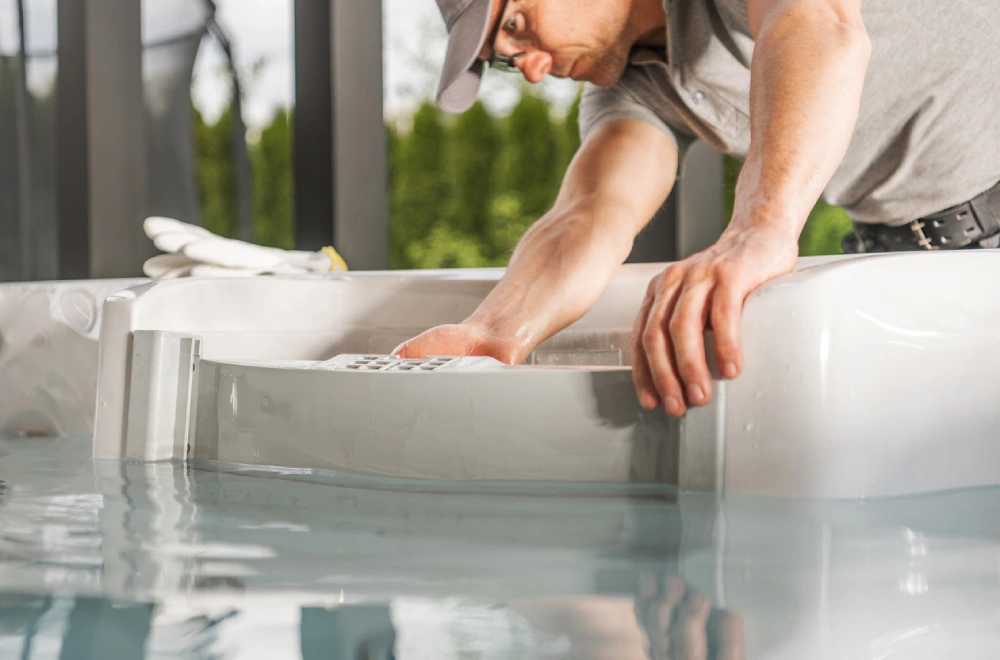 Hot Tub Technician Working On A Hot Tub Filter
